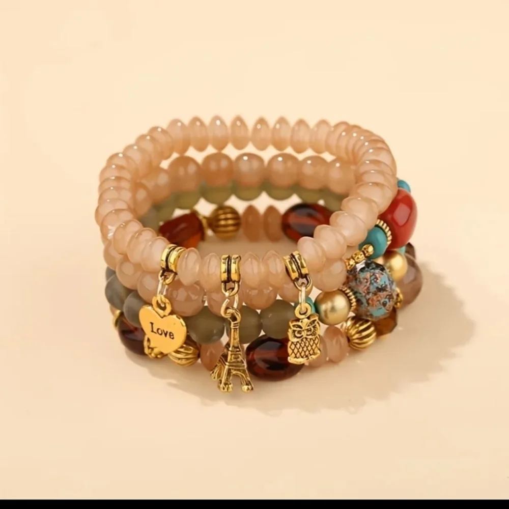 Brand new beautiful women's 4 beaded bracelets with charms